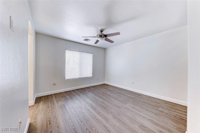 11028 Meadow Leaf Ave, Las Vegas, NV 89144 - spare room featuring a ceiling fan, wood finished floors, and baseboards