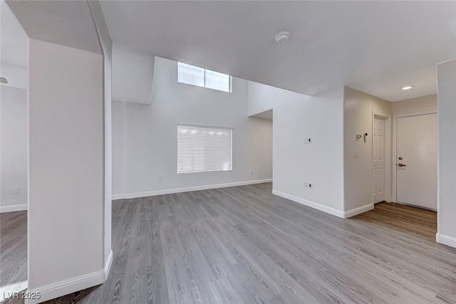 11028 Meadow Leaf Ave, Las Vegas, NV 89144 - unfurnished living room featuring wood finished floors and baseboards