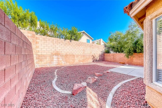 11028 Meadow Leaf Ave, Las Vegas, NV 89144 - fenced backyard with a patio area