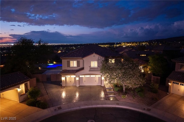 2900 Valvent Ct, Henderson, NV 89044 - mediterranean / spanish home with a garage, stucco siding, a tiled roof, driveway, and a swimming pool
