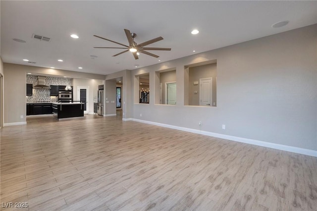 2900 Valvent Ct, Henderson, NV 89044 - unfurnished living room featuring a ceiling fan, light wood finished floors, baseboards, and recessed lighting