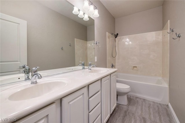 2900 Valvent Ct, Henderson, NV 89044 - bathroom with bathing tub / shower combination, wood finished floors, toilet, and double vanity