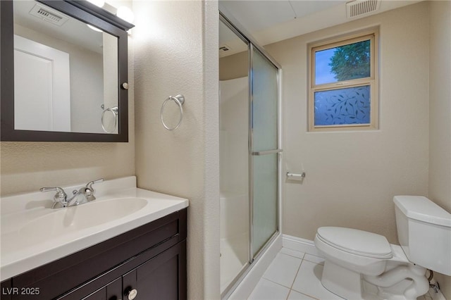 2900 Valvent Ct, Henderson, NV 89044 - bathroom with a shower stall, toilet, tile patterned floors, and vanity