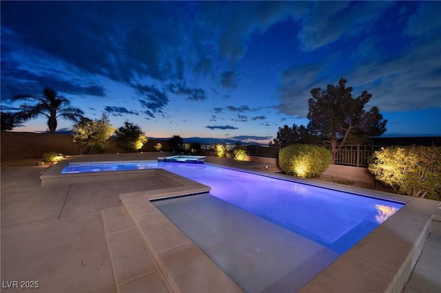 2900 Valvent Ct, Henderson, NV 89044 - pool at dusk featuring a fenced backyard, a pool with connected hot tub, and a patio area