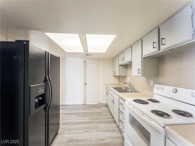 26 E Atlantic Ave, Henderson, NV 89015 - kitchen featuring electric stove, black fridge with ice dispenser, a sink, and light countertops