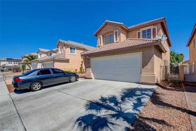 8370 Lost Lake Ct, Las Vegas, NV 89147 - view of front of property with stucco siding, concrete driveway, a tile roof, fence, and an attached garage