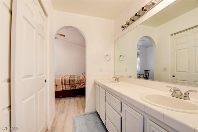 8370 Lost Lake Ct, Las Vegas, NV 89147 - bathroom featuring wood finished floors, double vanity, and ensuite bathroom