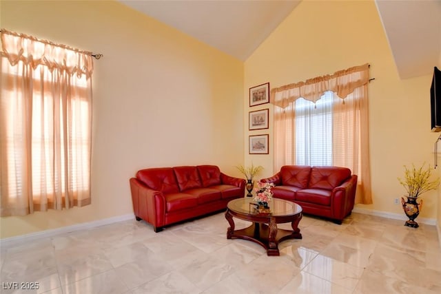 8370 Lost Lake Ct, Las Vegas, NV 89147 - living area with high vaulted ceiling, baseboards, and light marble finish floors