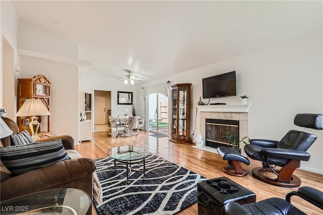5401 Bugle Way Unit 103, Las Vegas, NV 89108 - living room featuring ceiling fan, wood finished floors, a fireplace, and baseboards