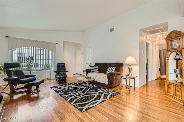 5401 Bugle Way Unit 103, Las Vegas, NV 89108 - living area featuring light wood-type flooring, baseboards, and lofted ceiling
