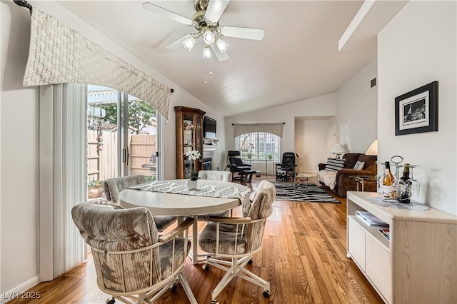 5401 Bugle Way Unit 103, Las Vegas, NV 89108 - dining room with a ceiling fan, light wood finished floors, and vaulted ceiling