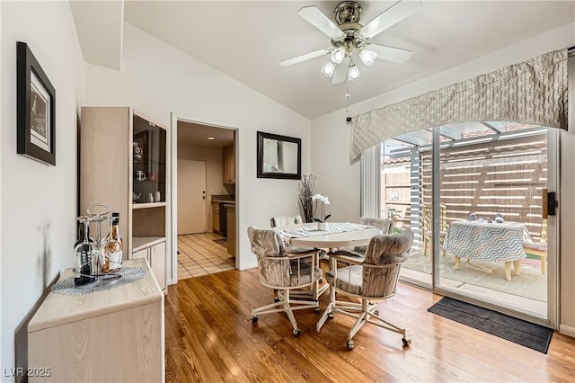 5401 Bugle Way Unit 103, Las Vegas, NV 89108 - dining room featuring vaulted ceiling, wood finished floors, and a ceiling fan