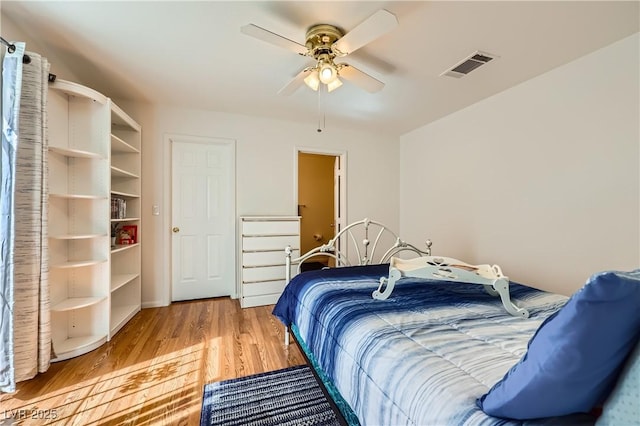 5401 Bugle Way Unit 103, Las Vegas, NV 89108 - bedroom with light wood-style flooring and ceiling fan