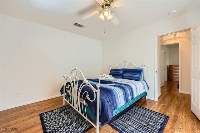 5401 Bugle Way Unit 103, Las Vegas, NV 89108 - bedroom featuring wood finished floors, ceiling fan, and baseboards