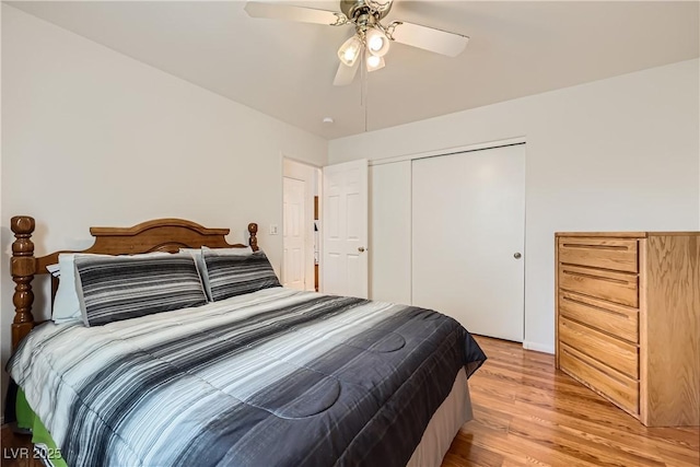 5401 Bugle Way Unit 103, Las Vegas, NV 89108 - bedroom with light wood-style flooring, a closet, and a ceiling fan