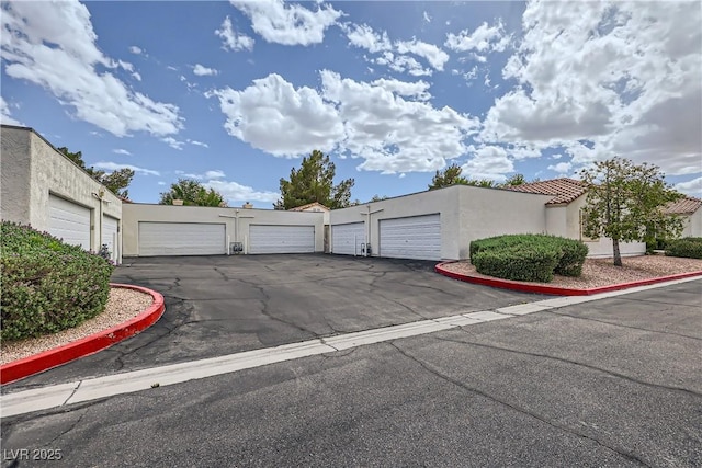 5401 Bugle Way Unit 103, Las Vegas, NV 89108 - exterior space featuring stucco siding and community garages