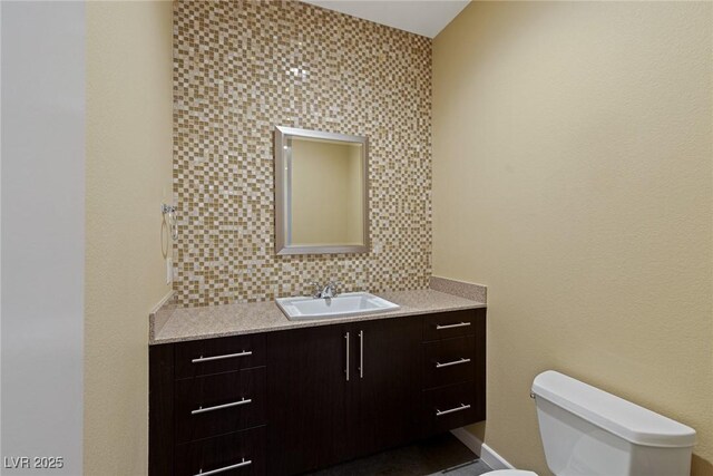 2672 Mystere Ct, Las Vegas, NV 89117 - half bath with vanity and decorative backsplash