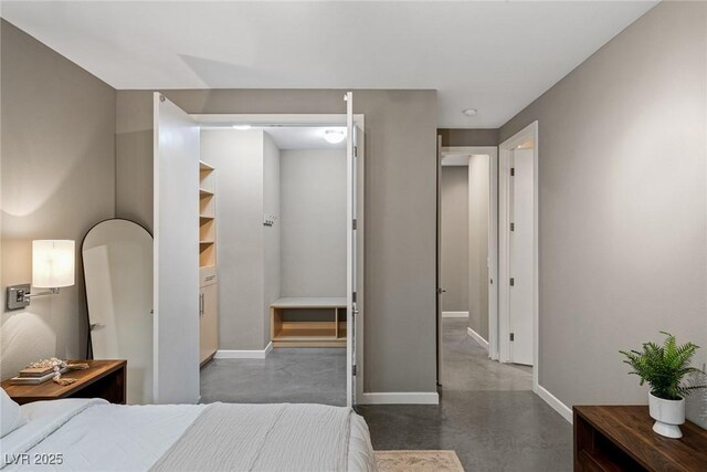 2672 Mystere Ct, Las Vegas, NV 89117 - bedroom featuring baseboards and finished concrete flooring