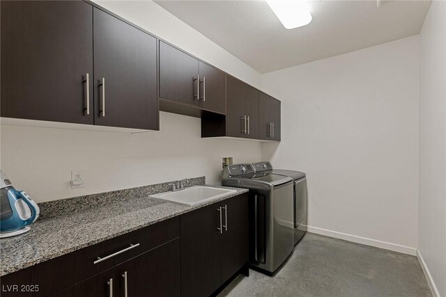 2672 Mystere Ct, Las Vegas, NV 89117 - laundry room with cabinet space and washer and clothes dryer