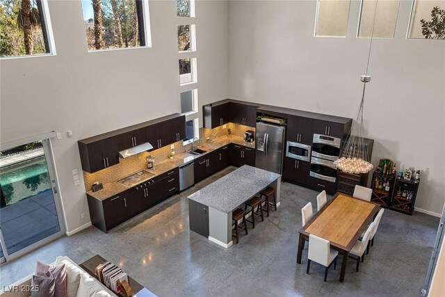 2672 Mystere Ct, Las Vegas, NV 89117 - living area with a towering ceiling and baseboards