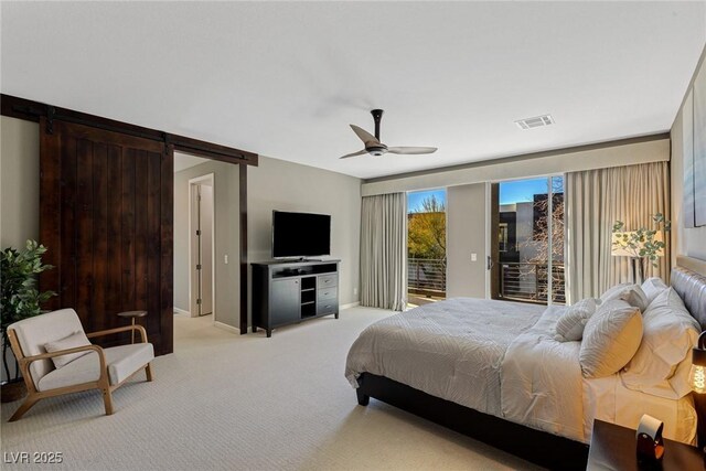 2672 Mystere Ct, Las Vegas, NV 89117 - bedroom featuring access to outside, light colored carpet, a barn door, and ceiling fan