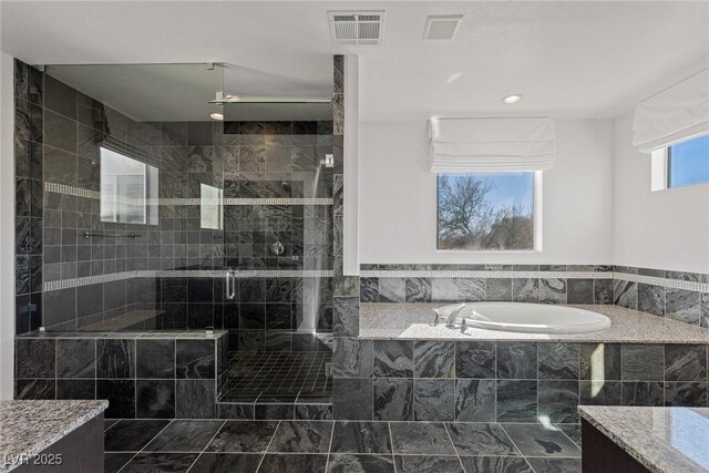 2672 Mystere Ct, Las Vegas, NV 89117 - bathroom with a bath and a shower stall