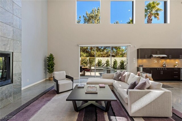 2672 Mystere Ct, Las Vegas, NV 89117 - living room with a high ceiling and a tiled fireplace