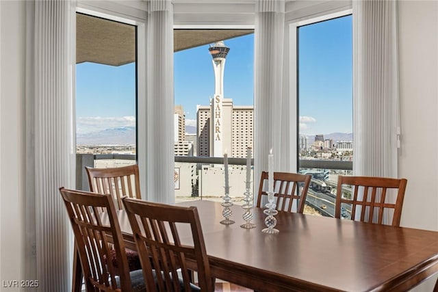 2777 Paradise Rd Unit 1105, Las Vegas, NV 89109 - dining area with a view of city and healthy amount of natural light