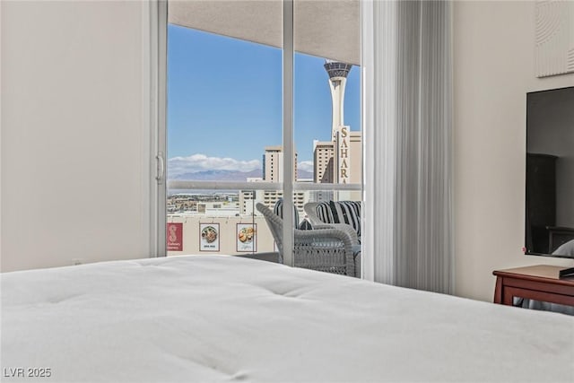 bedroom featuring expansive windows