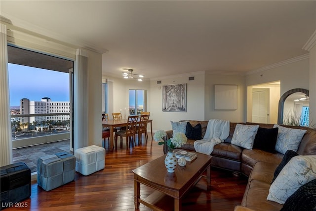 2777 Paradise Rd Unit 1105, Las Vegas, NV 89109 - living room featuring crown molding, hardwood / wood-style floors, healthy amount of natural light, and a ceiling fan