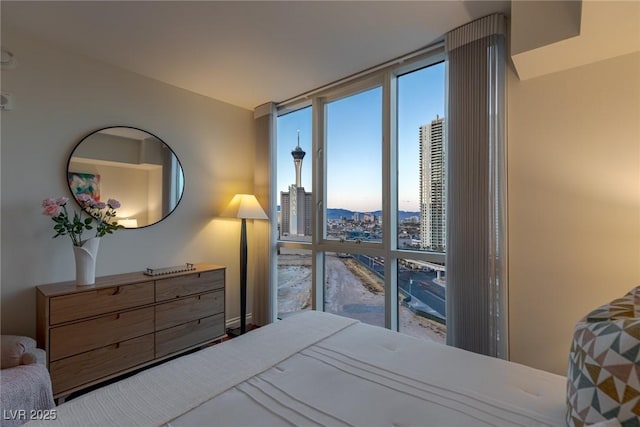 bedroom featuring a city view