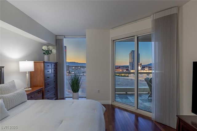 2777 Paradise Rd Unit 1105, Las Vegas, NV 89109 - bedroom with wood-type flooring, access to exterior, and baseboards