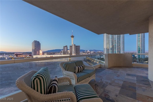 view of patio featuring a city view and a balcony