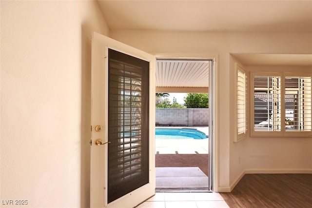 6016 Bungalow Bay St, Las Vegas, NV 89130 - doorway featuring baseboards and wood finished floors