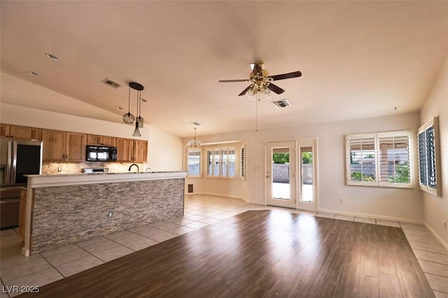 6016 Bungalow Bay St, Las Vegas, NV 89130 - unfurnished living room with ceiling fan, light wood-style floors, lofted ceiling, a sink, and baseboards