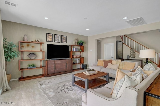 living room featuring recessed lighting and baseboards