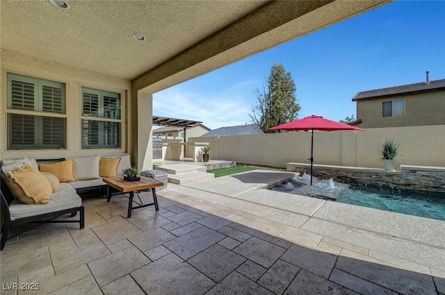 view of patio / terrace featuring outdoor lounge area, fence, and a jacuzzi