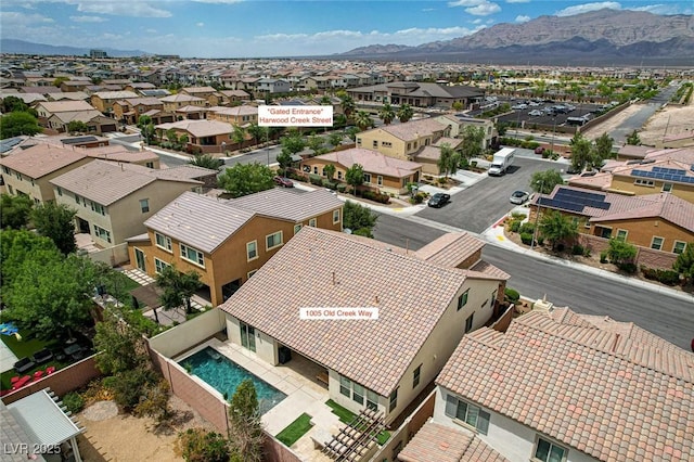aerial perspective of suburban area featuring a mountain backdrop