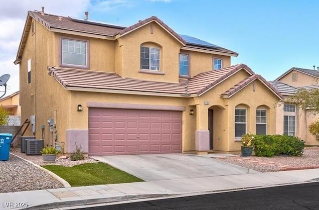 7129 Dillseed Dr, Las Vegas, NV 89131 - view of front facade featuring roof mounted solar panels, stucco siding, a garage, and concrete driveway