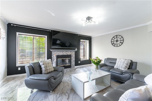 living room featuring ornamental molding, a fireplace, marble finish flooring, and baseboards