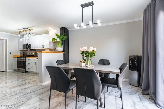dining space with crown molding, light marble finish floors, and baseboards