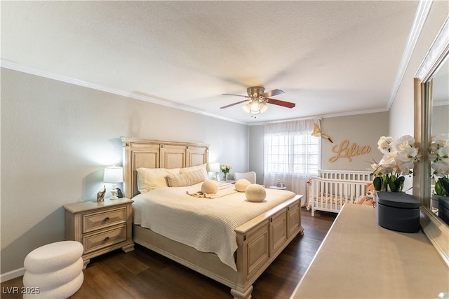 bedroom featuring ornamental molding, dark wood-type flooring, and ceiling fan