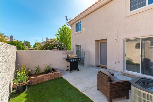 view of patio / terrace featuring cooling unit, a fenced backyard, and area for grilling