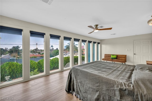 bedroom featuring wood finished floors and ceiling fan