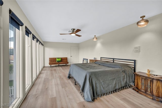 bedroom featuring light wood-style flooring and ceiling fan