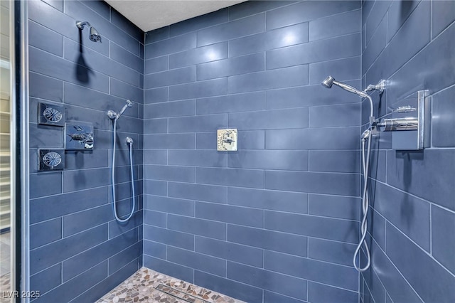 full bathroom with tiled shower