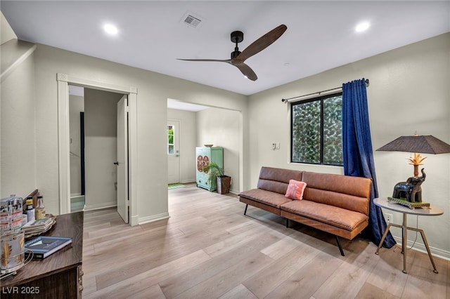 living area with ceiling fan, light wood-style flooring, baseboards, and recessed lighting