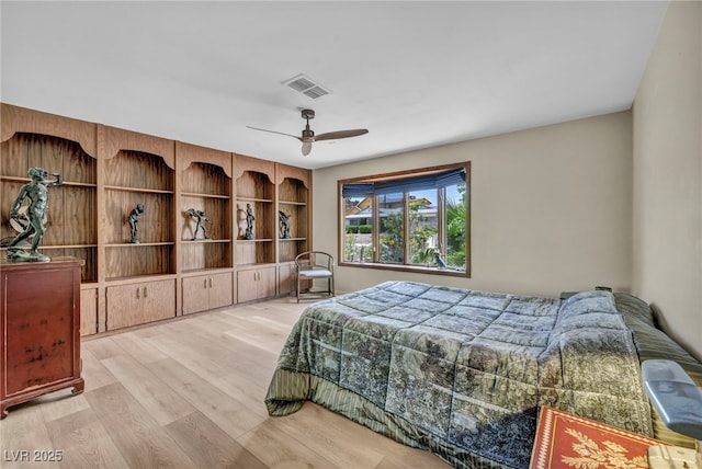 bedroom featuring wood finished floors and a ceiling fan
