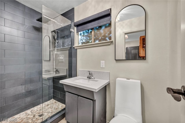 bathroom with a walk in shower and vanity