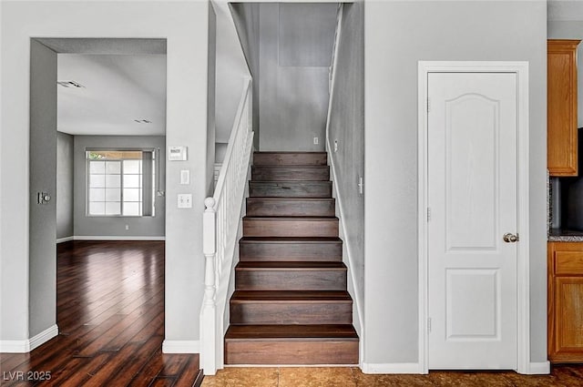 10135 Diving Duck Ave, Las Vegas, NV 89117 - stairs featuring baseboards and hardwood / wood-style floors